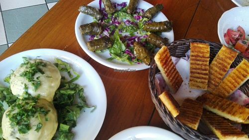 Stuffed champis, dolmades, garlic bread at Milos Taverna in Crete