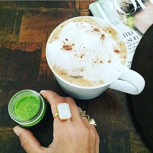  Organic coconut mylk cinnamon Latte and a "hawk shot" made with juiced cilantro, wheatgrass, lemon, ginger, cayenne, and turmeric!  at Island Bee in Palm Beach