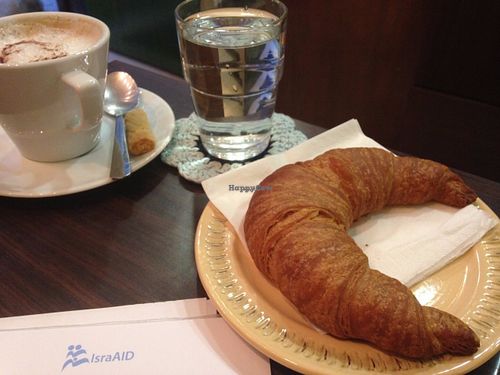 Spelt home-made croissant, vegan cappuccino.    at Fresco Bio Cafe in Katerini