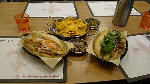 Regular bahn mi sandwich (left), nacho with cheese (top), Buddhist vegetarian bahn mi sandwich (right), a little gift from the chef (center). at Lagniappe in Seongnam