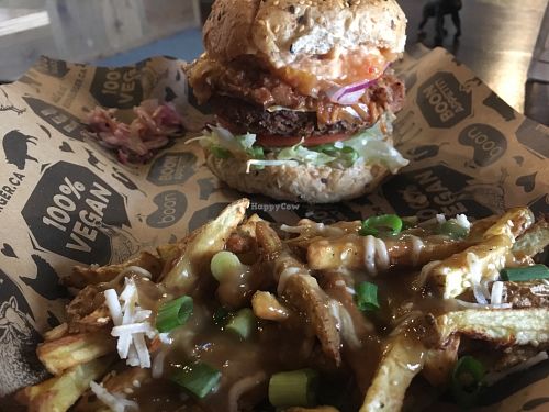 “Jamaican Me Crazy” burger with a side Poutine at Boon Burger Cafe in Guelph