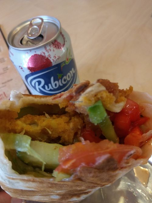 Cauliflower pakora in a wrap with lychee juice. at The  Pakora Bar in Edinburgh