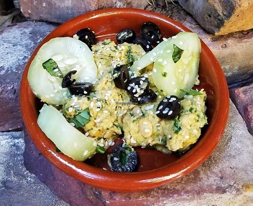 PURÉE DE POIS CHICHE 
Mashed garbanzo beans puree, cucumbers & black olives at Delice & Sarrasin in New York City