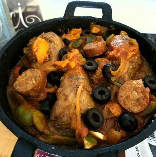 poulet basquaise, V. chicken legs slowly marinated with v. chorizo, melted peppers, onions & tomatoes served with couscous
 at Delice & Sarrasin in New York City