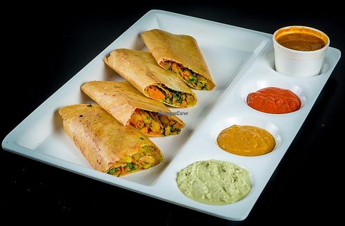 Creep Made of rice flour on grill with potato and vegetable stuffing served with 3 different dipping sauce  at Chowpatty Express in Katy