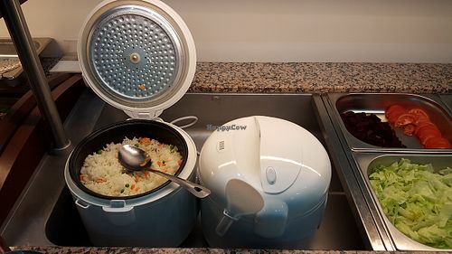 The new asian buffet has rice directly from the ricecooker. Plain rice and rice with some peas. at Butterfly in Basel