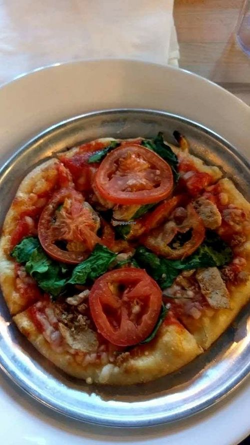 Vegan cheese,  roasted chicken,  spinach & tomato pizza  at Bend Pizza Kitchen in Bend