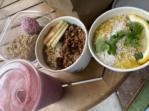 The Dali smoothie (so good!), raspberry powerball, pear square, oatmeal bowl and a nice warm dish for lunch! at The Green Moustache in Squamish