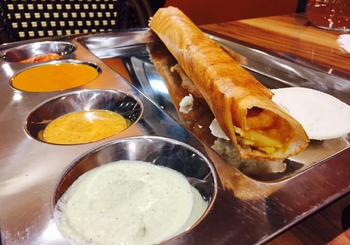 Filled dosa and various dipping sauces at Dosa Joy in Knoxfield
