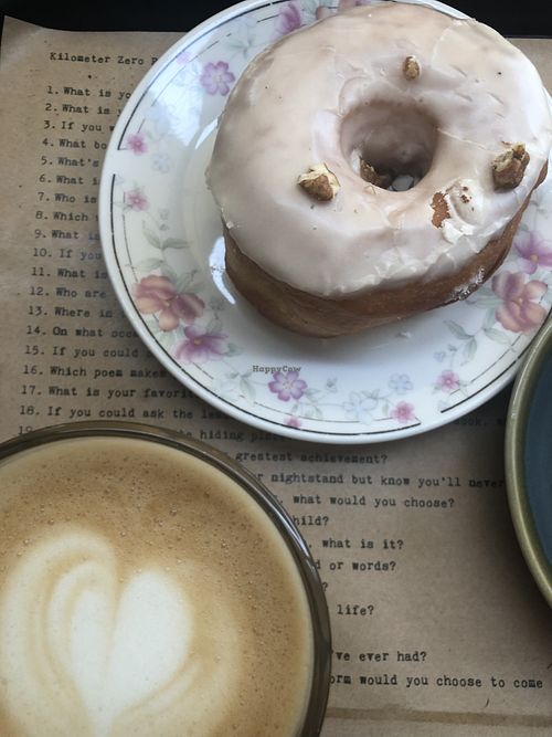 Oat café au lait and vegan donut  at Shakespeare and Company Cafe in Paris