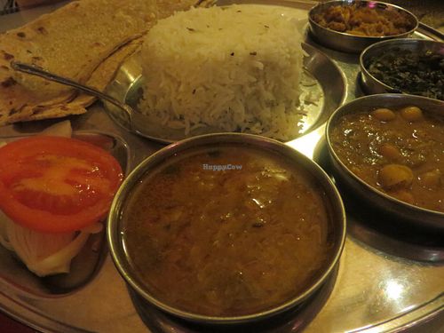 no. 36 vegetarian thali (four kinds of vegetarian curries: cauliflower, potatoes, dal (lentils,) saag (spinach,) channa (chickpeas,) tomatoes, onions, basmati rice, without raeta (spiced yoghurt) and with chapati instead of naan (flatbread)) (vegan) at Star of India in Saarbrucken