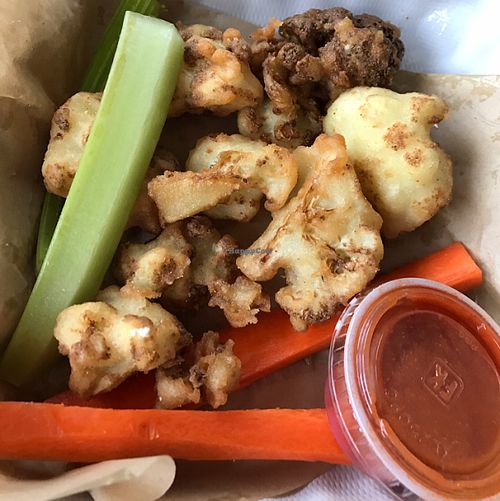 Buffalo Cauliflower Wings comes with sauce on the side at Jewel's Bakery and Cafe in Phoenix