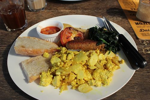 Tofu scramble, sauteed greens ( a little salty, though), bread, baked beans, tomatoes, mushrooms and incredible homemade sausage!   at Cafe Culture in Koh Tao
