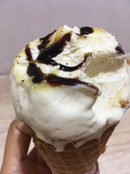 Drizzle of balsamic vinegar on top of the olive oil ice cream  at Nice Cream in Taipei
