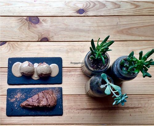 Vegan banana chocolate chip ice cream with sweet peanut butter sauce and creamy avocado chocolate cake.  at Foodprintz Cafe in Lisbon