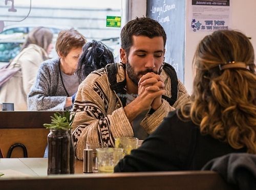 people enjoying food :) at Foodprintz Cafe in Lisbon