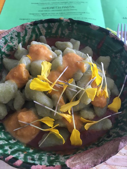 Handmade guacamole gnocchi with tomato & black bean sauce and corn dots  at Hearth  in Amsterdam
