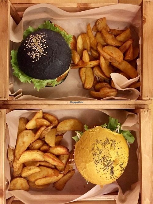 black bun and cheesy burger at Flower Burger - Porta Genova in Milan