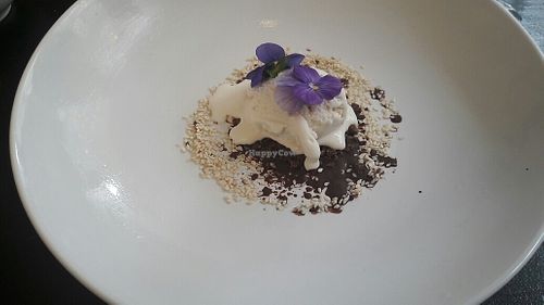 Desert vanilla ice cream with edible flowers at The Organic LAB in Copenhagen