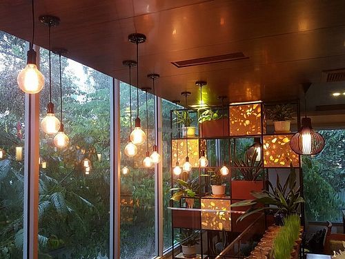 Warm atmosphere in raining day at Biogarten Restaurant in Ho Chi Minh City