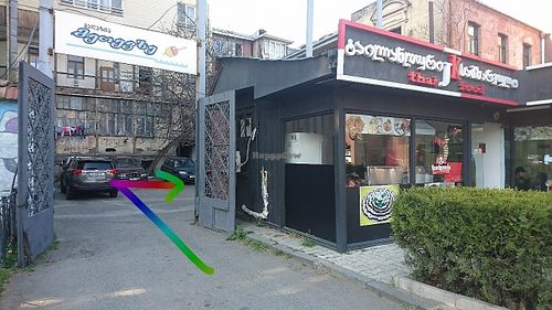 Go through courtyard gates next to Thai restaurant, building on the right at Hummusbar in Tbilisi