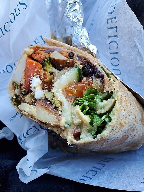 This is the roasted vegetable, hummus, and chutney wrap. It is so good and so filling. at Leg Up Farmers Market in York