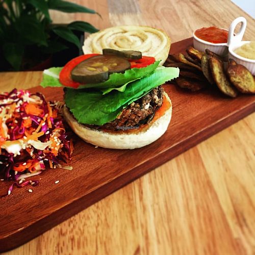 The Nourish Burger with Asian slaw and sweet potato crisps, sweet sandwich pickles, BBQ relish and lemon mayo at Nourish Cafe in Yangon