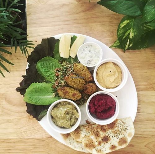 Middle Eastern Mezze with falafel, lavash, babghanoush, muhummara, hummus, tahini dressing and tabouleh at Nourish Cafe in Yangon