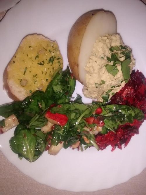 Baked potato, hummus, and salads - example of Main at Vegan People's Kitchen in Glasgow