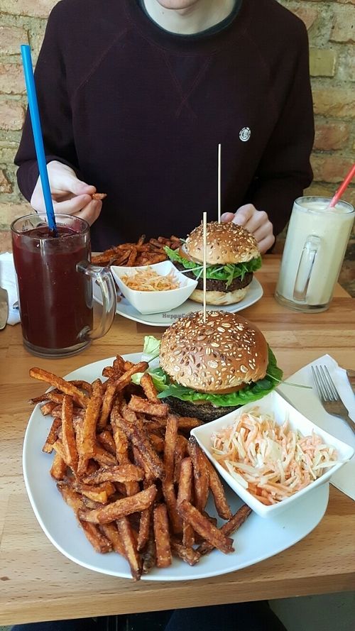 quinoa and lentil burger, bbq burger, sweet potato fries, colslaw, red berry smoothie and 'the classic' smoothie at Lia's Kitchen in Berlin