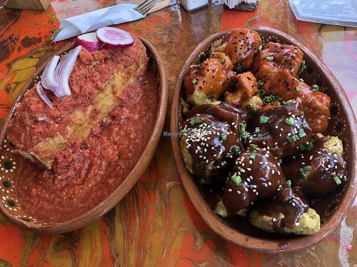 Torta Ahogada (big baguette sandwich with mushrooms covered in salsa) and Alitas Coliflor Capeadas (aka. “cauliflower wings”).  at La Flaca - Americana in Guadalajara