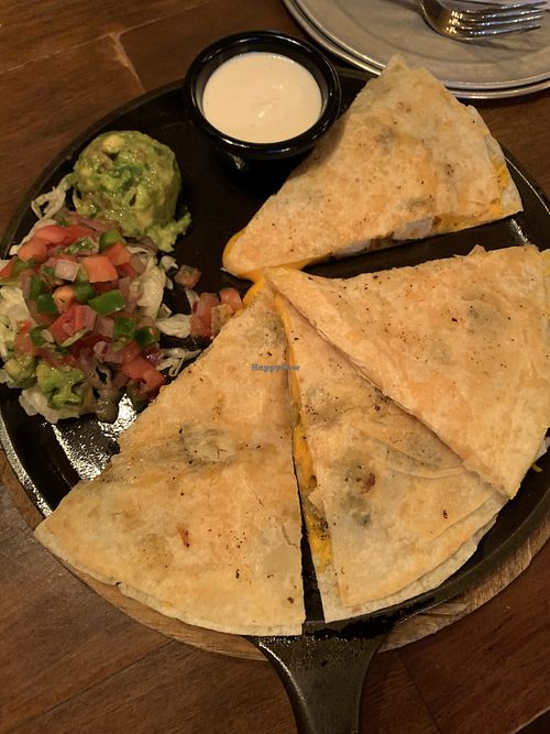 Vegan chicken quesadilla with vegan sour cream, guacamole, and pico de gallo  at Nacho Daddy - Summerlin in Las Vegas