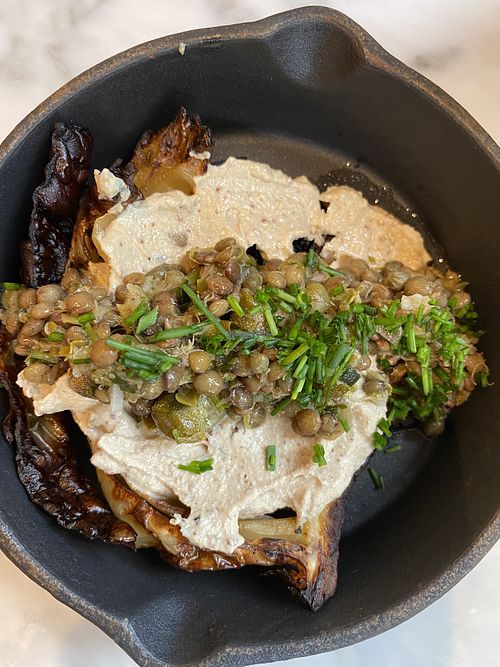 Grilled cabbage with tahini and lentils  at Plants by Deliciously Ella in London