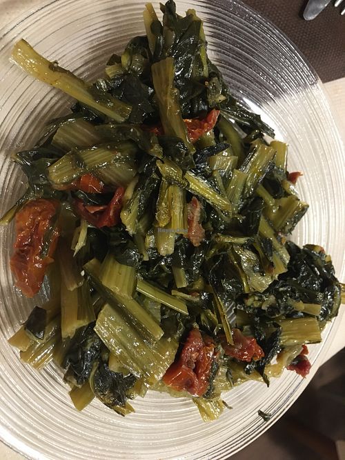 Chicoria with tomato  at La Tecia Vegana in Venice