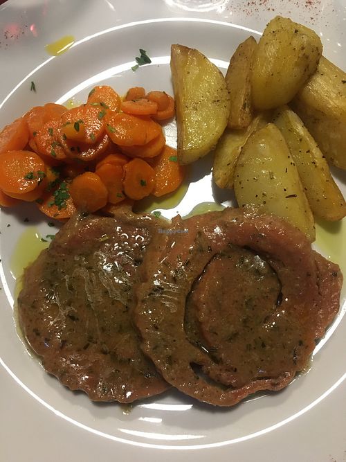 Homemade roast seitan with carrots and potatoes  at La Tecia Vegana in Venice