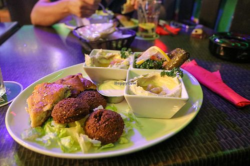 vegan plate - falafel with tahini sauce, hummus, baba ghanoush, stuffed vine leaves, tabbouleh, and pastries at Beirut SXM  in Simpson Bay