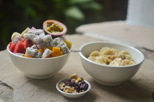 A generous fruit salad, that will keep you full for a long time, and a heart-healthy oat porridge with a homemade crunchy blend of superfoods. at Peace Food Cafe in Sihanoukville