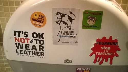 Animal right stickers in the bathroom at Le Faitout Vegan in Paris