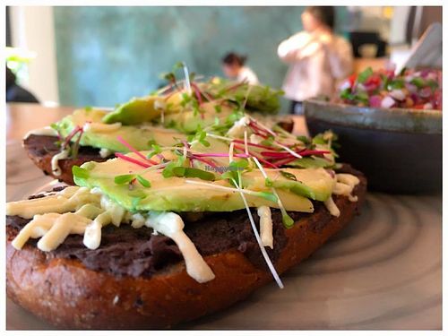 Molletes 100% veganos con aguacate y pico de gallo at Aura Vegana in Mexico City