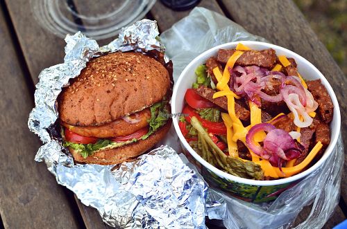 Chickpea burger + salad, topped with seitan strips and vegan cheese. at Las Vegan's - Kazinczy Trailer in Budapest