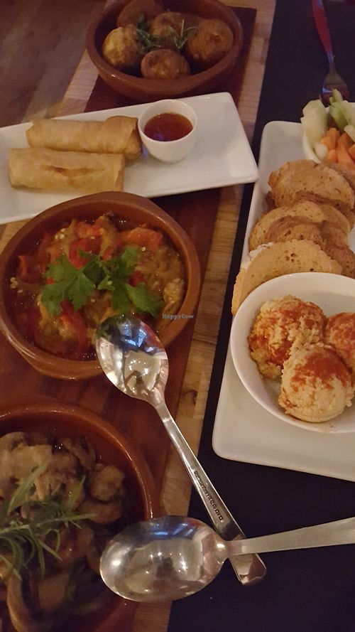 Part of our vegan tapas board, I couldn't fit it all in the photo but it included vegan omelette, an aubergine dish, garlic mushrooms, potato croquettes, homemade hummus and crudités and veg spring rolls at The Gourmet Market in Oslo