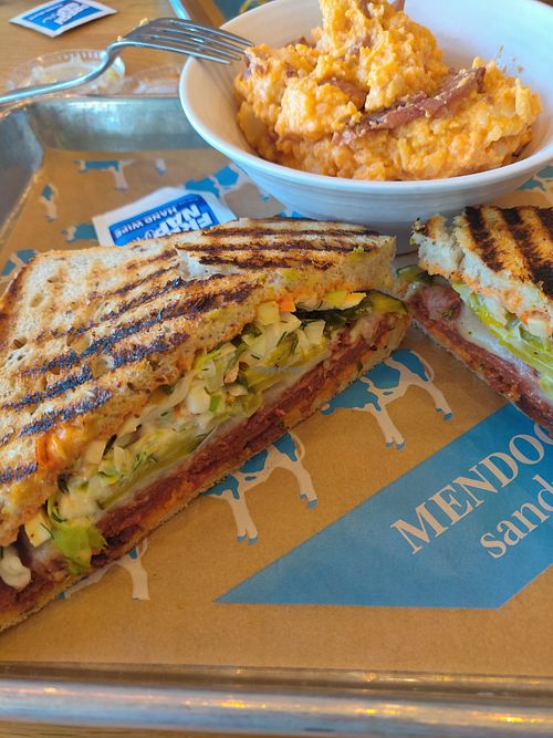 An Unreal Pastrami Reuben with potato salad! at Mendocino Farms in Costa Mesa