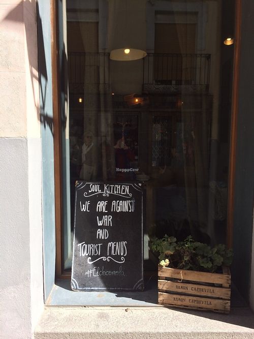 Sign in Soul Kitchen window:
We are against war and tourist menus! at Soul Kitchen in Avila