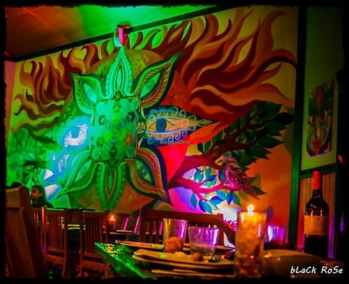 The large mural on the wall of the restaurant. at Paradise One Retreat in Coorabell