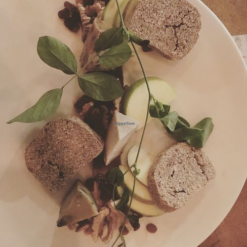 Cheese taster plate: 3 kinds of cheese, bread, walnuts, dates, raisins, apple slices and I think pomegranate molasses  at Sayuri Healing Food in Ubud