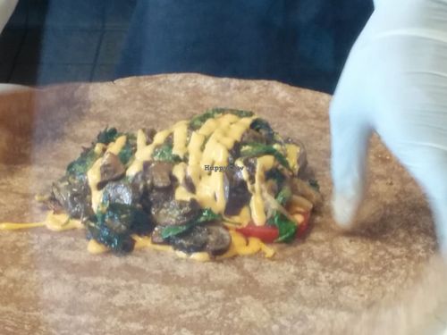 Prepping BarBChew philly cheese steak quesadilla at The Veg Hub in Oakland