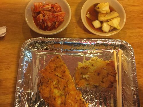 Pancake, (questionable) kimchi, and onions  at Soonheene Bindaeddeok - 순희네 빈대떡 in Seoul