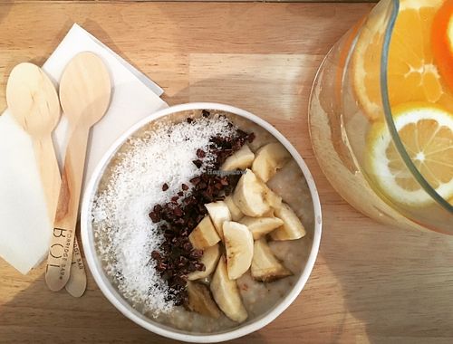 Porridge topped with banana coconut and cacao nibs at BOL Porridge Bar in Paris