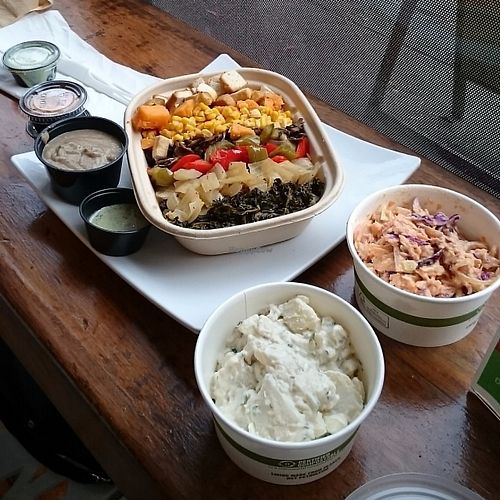 Potato bowl with side of slaw & potato salad.  at PlantPure Cafe in Philadelphia
