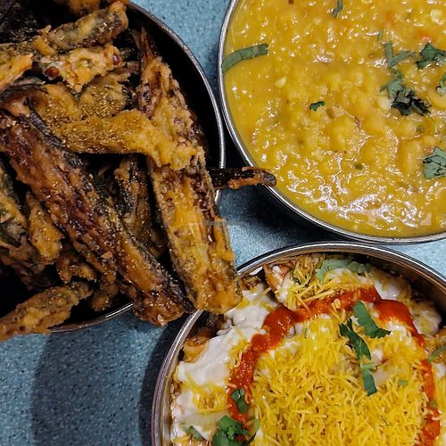 Samosa chaat, okra fries, and dhal with rice at Bundobust in Manchester